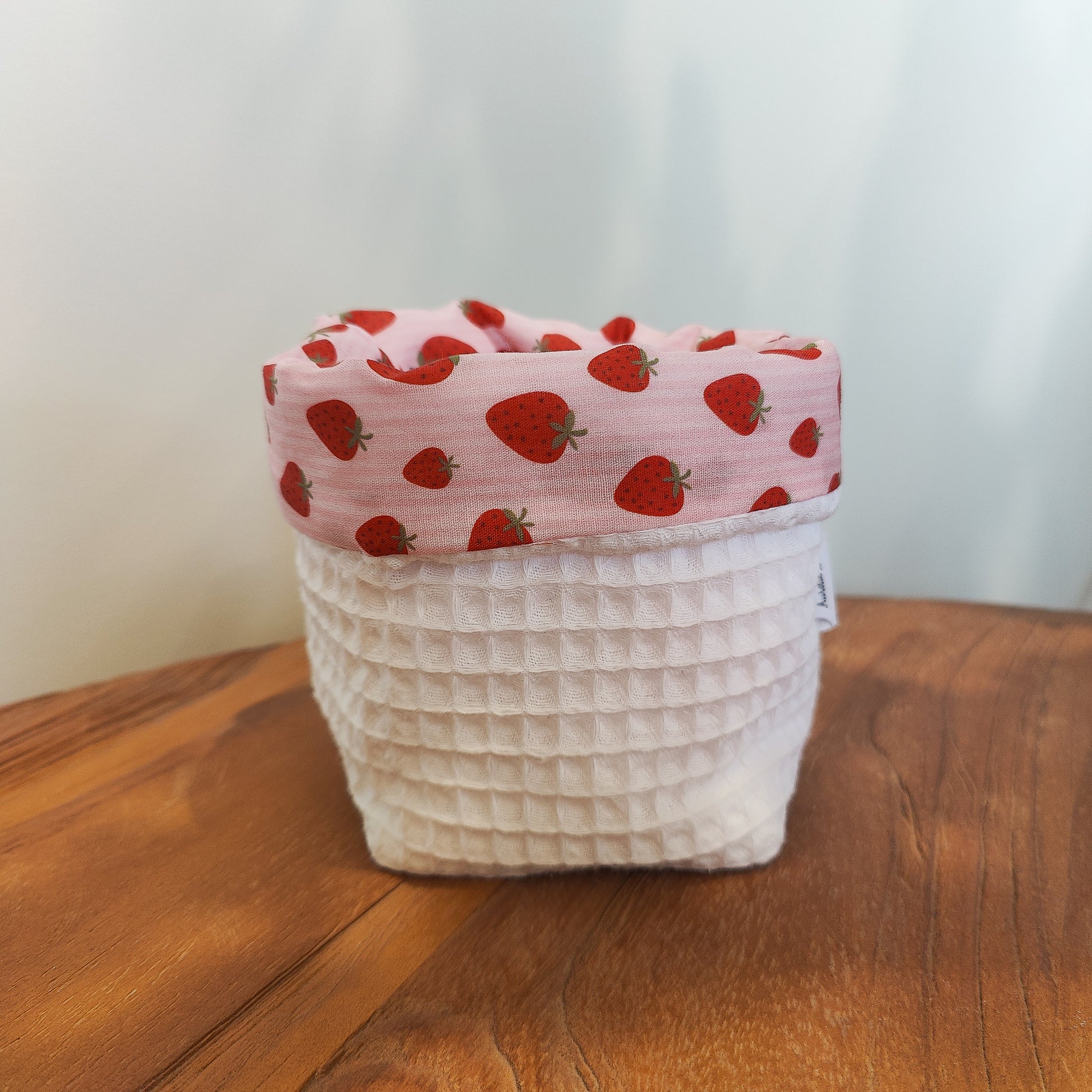 Handmade waffle cotton storage basket with pink strawberry print lining