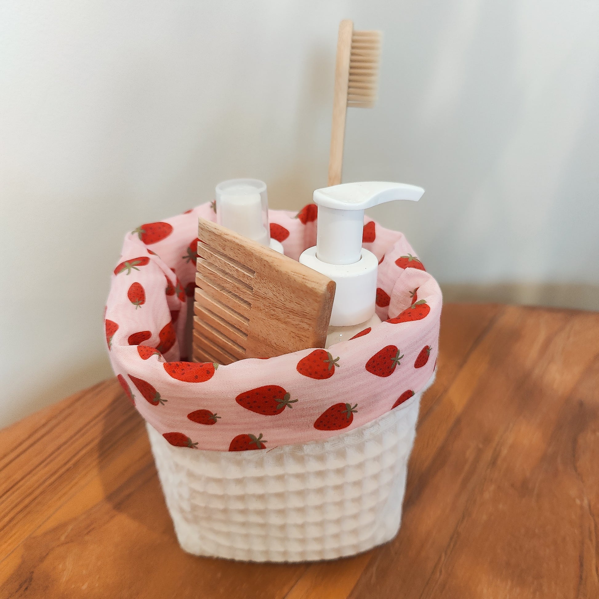 Handmade waffle cotton storage basket with pink strawberry print lining