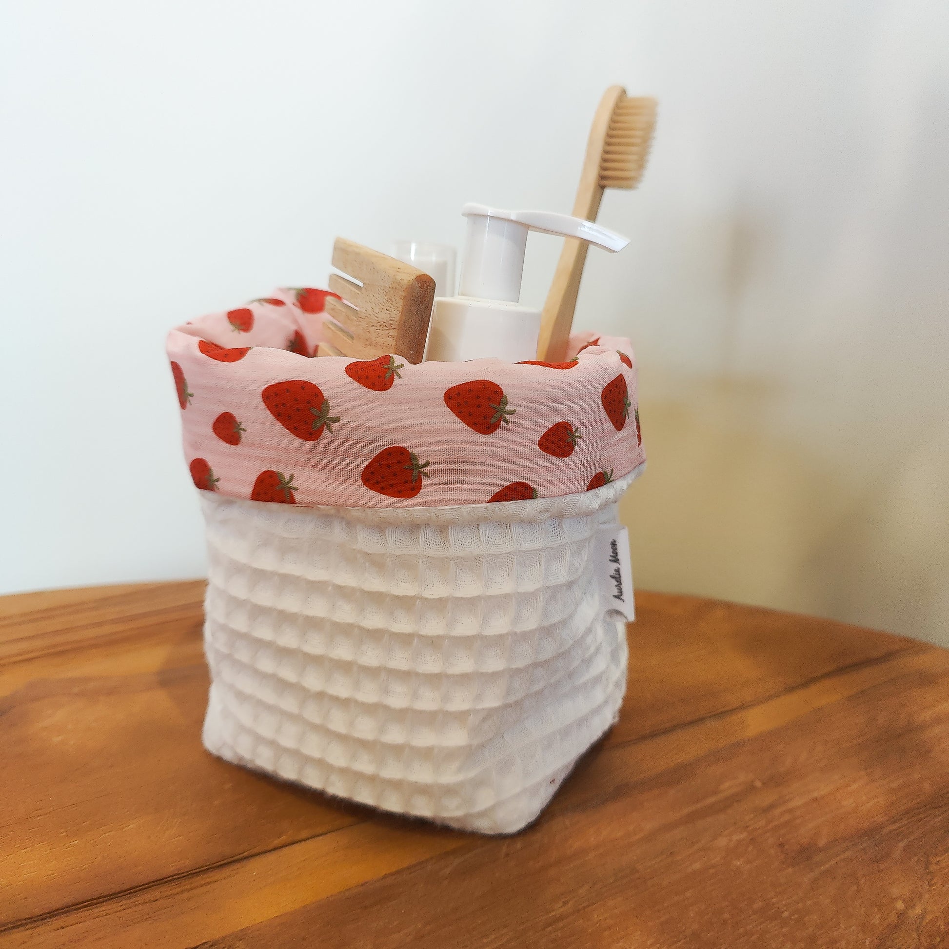 Handmade waffle cotton storage basket with pink strawberry print lining
