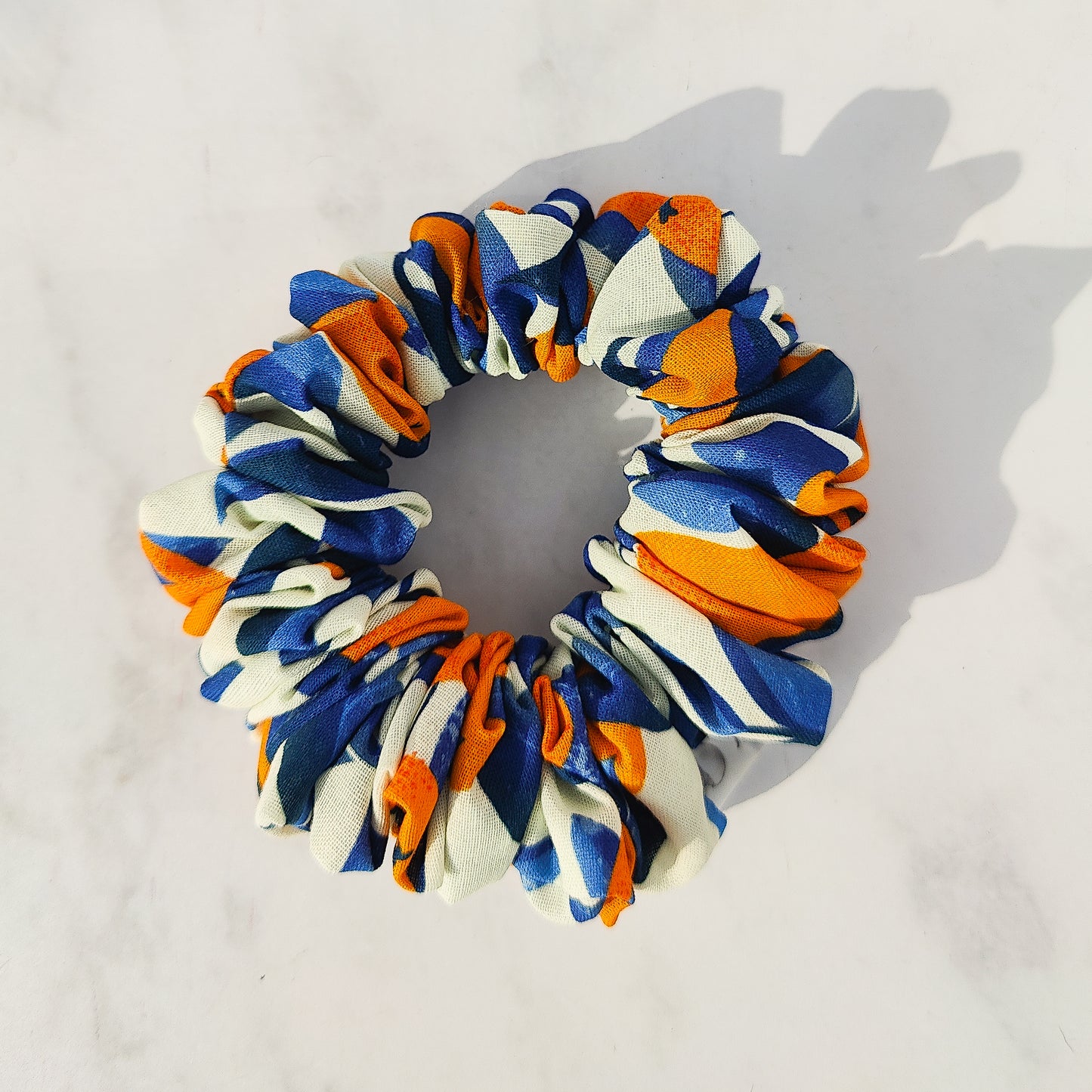 Handmade orange print scrunchie in cotton fabric