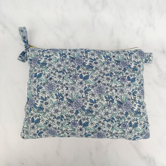 large quilted toiletry travel bag in blue floral print