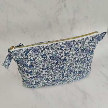 large quilted toiletry travel bag in blue floral print