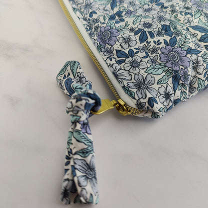 large quilted toiletry travel bag in blue floral print
