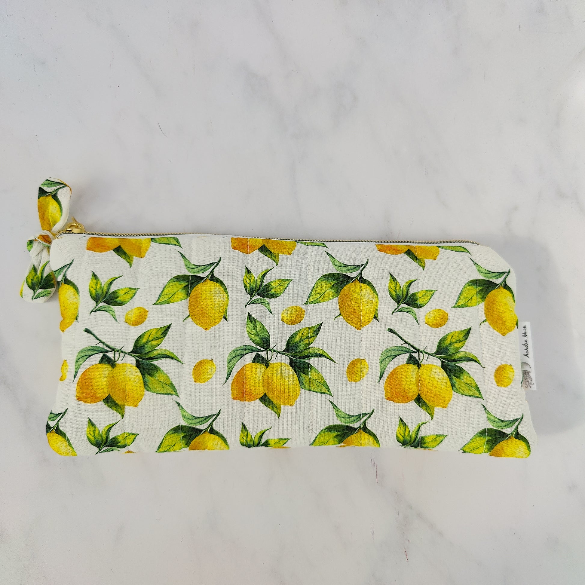 Pouch with lemon pattern on a plain background