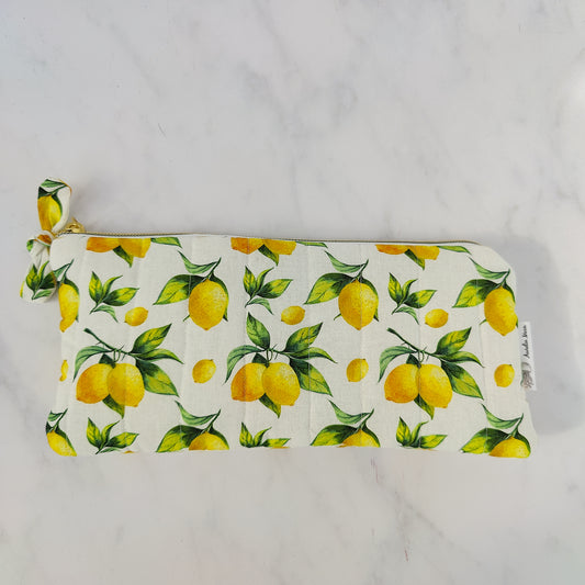 Pouch with lemon pattern on a plain background