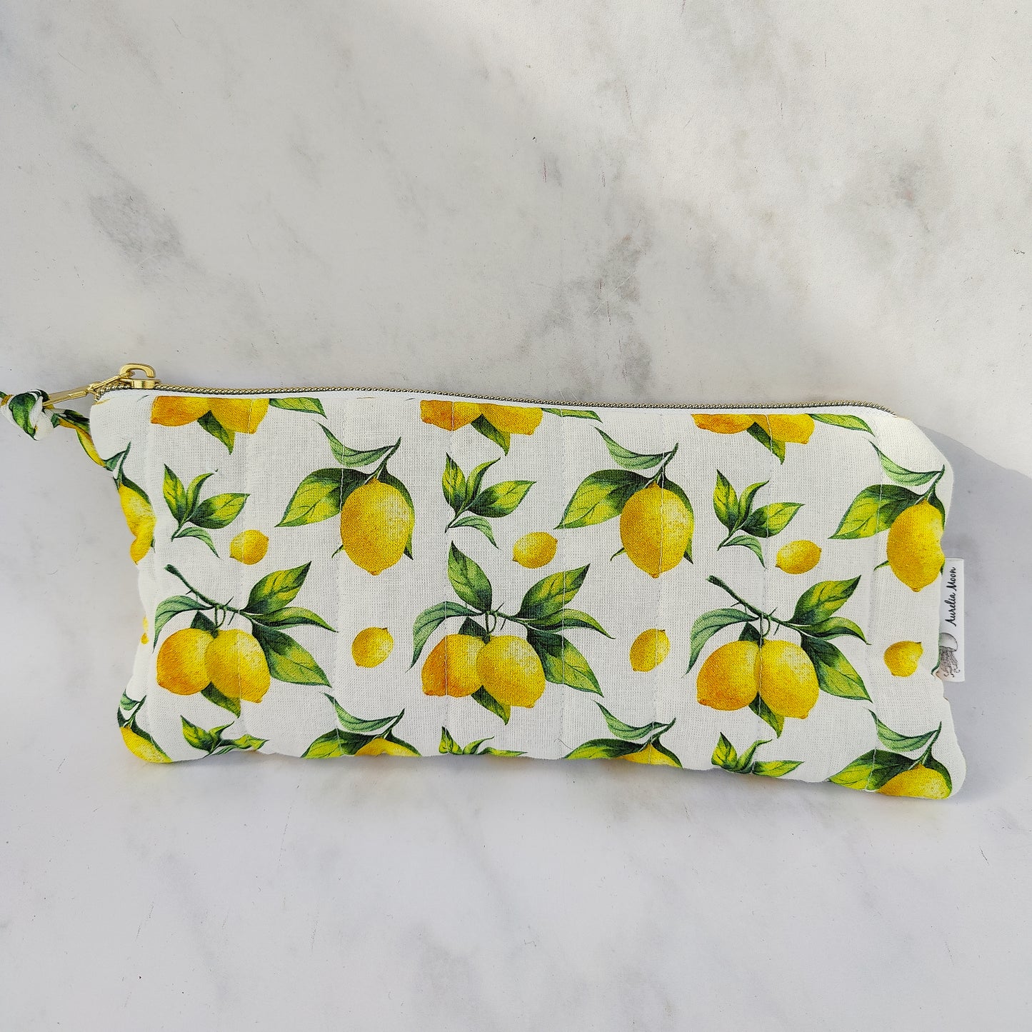 Pouch with lemon pattern on a white background