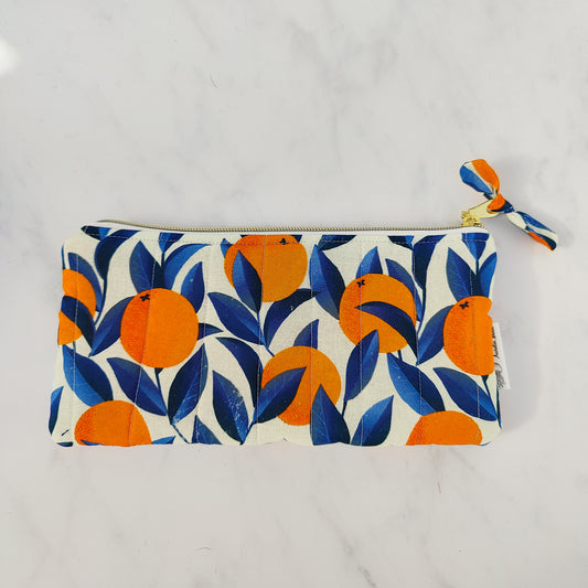 Handmade orange print zip pouch with cotton waffle lining