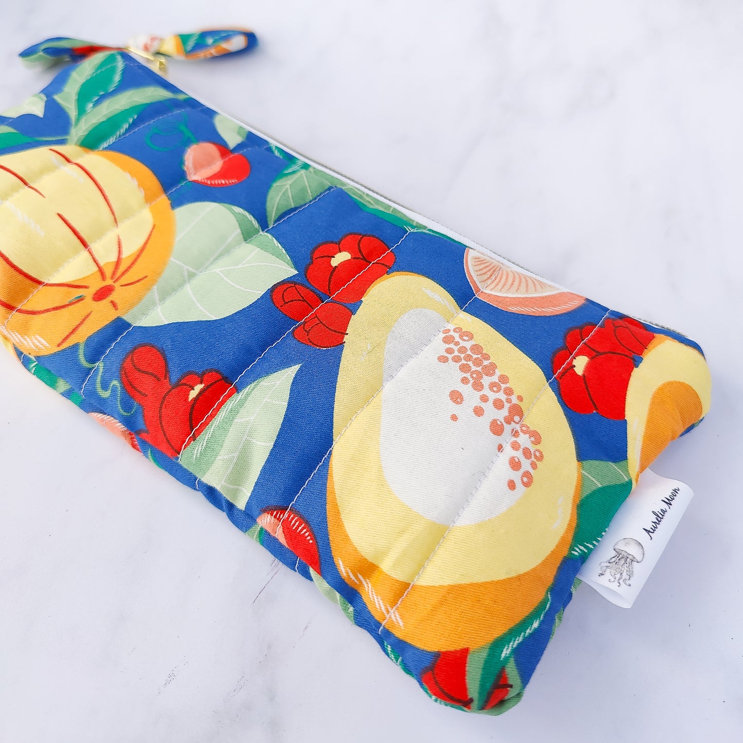 Handmade quilted fruit print zip pouch with cotton waffle lining