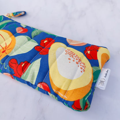 Colorful make up bag with fruit pattern on a white background
