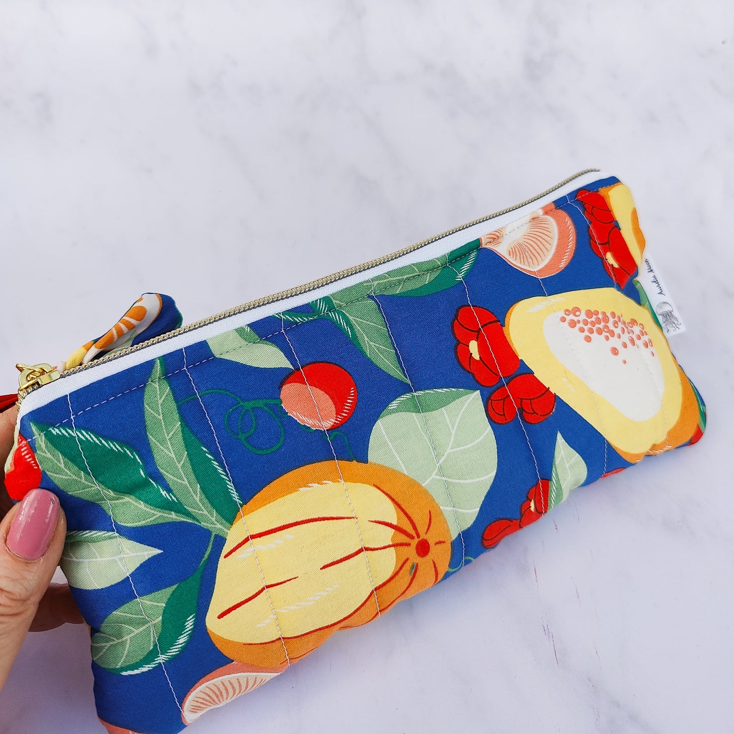 Handmade quilted fruit print zip pouch with cotton waffle lining